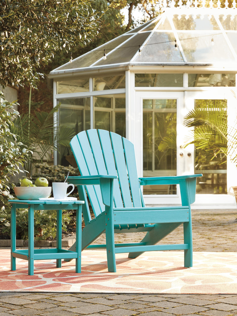 Ashley Furniture Sundown Treasure outdoor seating set with a table and chairs on a patio, ideal for outdoor dining and relaxing.