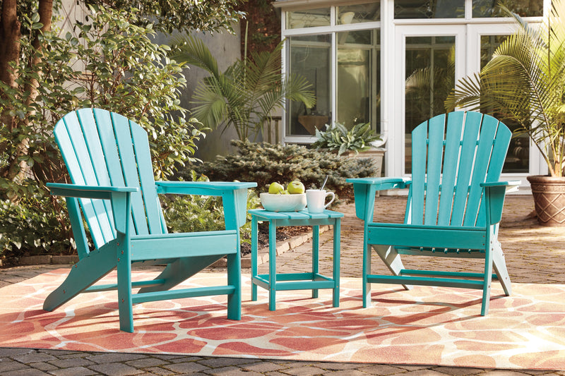 Outdoor table set from Ashley Furniture's Sundown Treasure collection with a table and matching chairs in a cozy outdoor setting.