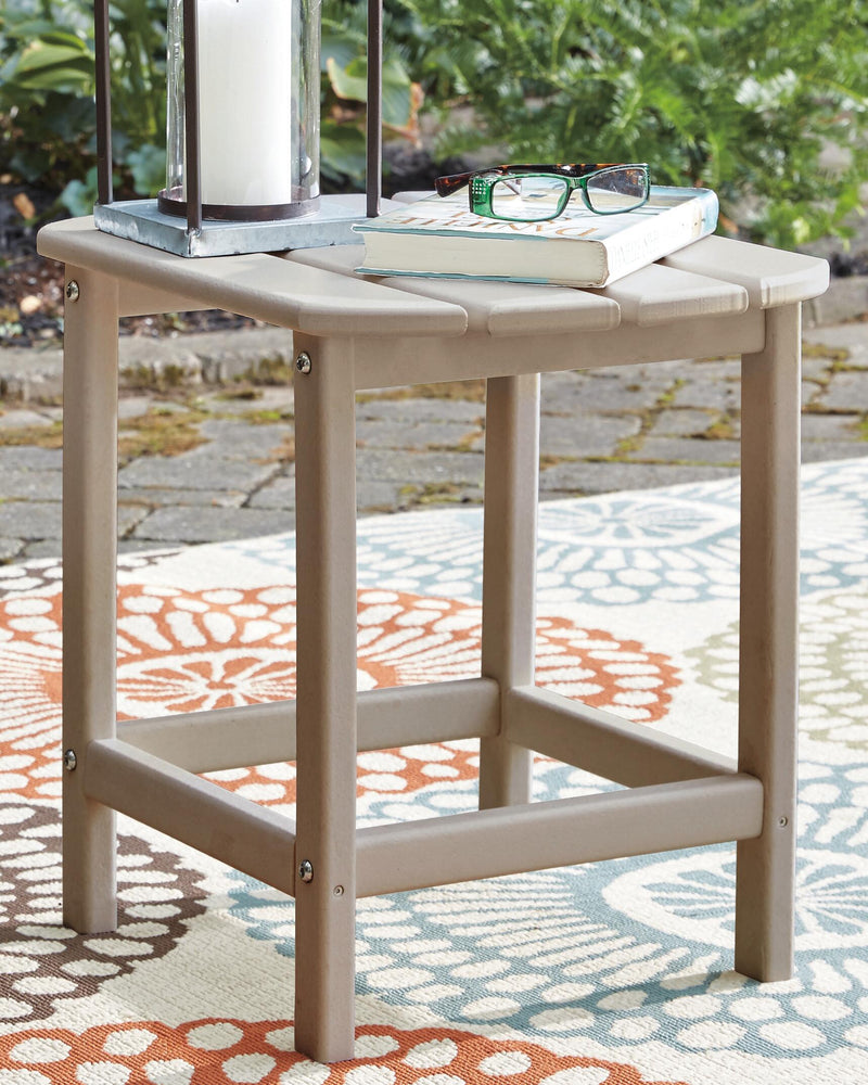 Ashley Furniture Sundown Treasure outdoor seating set with table and chairs, featuring woven design and cushioned seats.