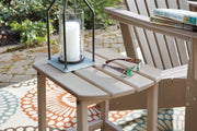 Close-up of the Ashley Furniture Sundown Treasure outdoor seating set with a table and cushioned chairs.