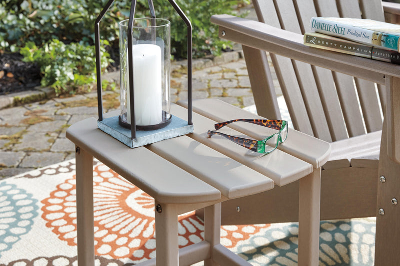Close-up of the Ashley Furniture Sundown Treasure outdoor seating set with a table and cushioned chairs.