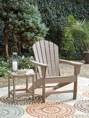 Ashley Furniture Sundown Treasure outdoor seating set with a table and chairs, perfect for garden or patio relaxation.