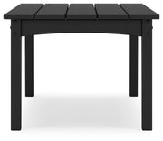 Ashley Furniture Hyland Wave outdoor cocktail table with a modern design, featuring a sleek surface and sturdy legs.