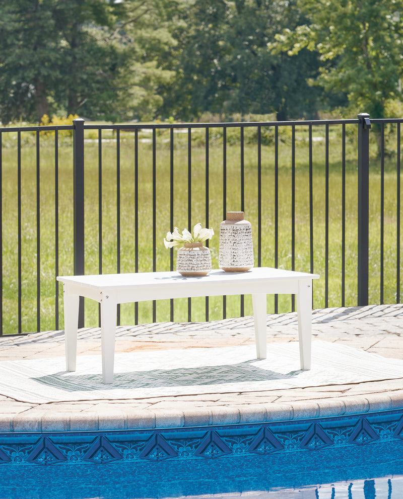 Outdoor cocktail table by Ashley Furniture featuring a modern design, perfect for outdoor living spaces.