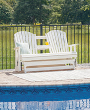 Ashley Furniture Hyland Wave outdoor loveseat with cushioned seats and pillows, perfect for patio relaxation.