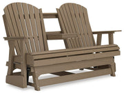 Ashley Furniture Hyland Wave outdoor glider loveseat with cushioned seating and a stylish, curved design for patio relaxation.