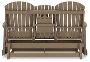 Ashley Furniture Hyland Wave outdoor glider loveseat with cushioned seating and a slatted backrest for outdoor relaxation.