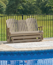 Ashley Furniture Hyland Wave outdoor loveseat glider with cushioned seating and wooden frame, perfect for patio relaxation.
