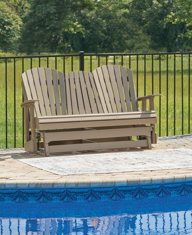 Ashley Furniture Hyland Wave outdoor loveseat glider with cushioned seating and wooden frame, perfect for patio relaxation.