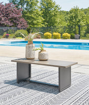 Ashley Furniture Bree Zee outdoor end table with a sleek, modern design featuring a woven surface and sturdy frame.