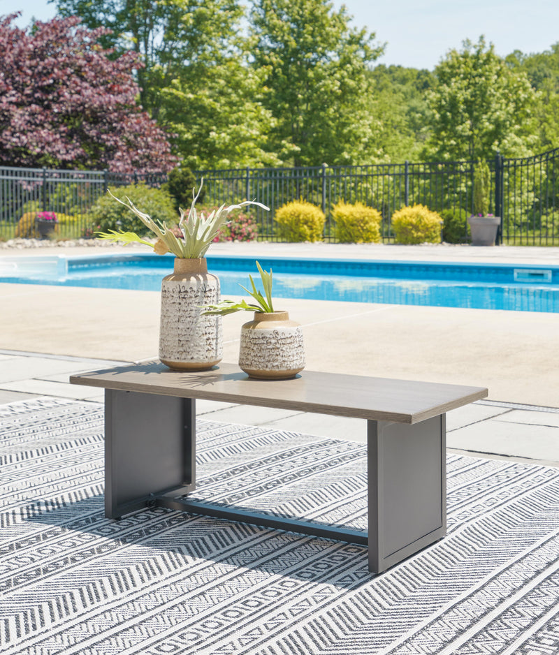 Ashley Furniture Bree Zee outdoor end table with a sleek, modern design featuring a woven surface and sturdy frame.