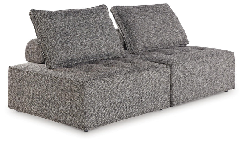 Ashley Furniture Bree Zee outdoor sectional with plush cushions and wicker frame, perfect for patio seating.
