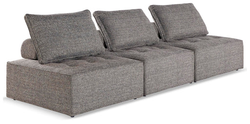 Outdoor modular seating by Ashley Furniture, Bree Zee style, showing a comfortable sectional with cushions in an outdoor setting.