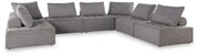 Ashley Furniture Bree Zee outdoor sectional with beige cushions and woven rattan frame, designed for outdoor seating comfort.