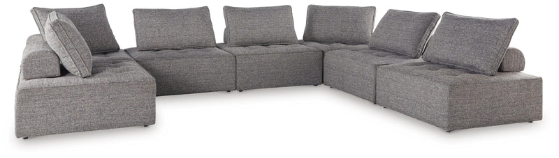 Ashley Furniture Bree Zee outdoor sectional with beige cushions and woven rattan frame, designed for outdoor seating comfort.