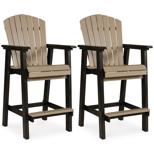 Set of two Ashley Furniture Fairen Trail outdoor barstools with metal frames and wooden seats, ideal for patio seating.