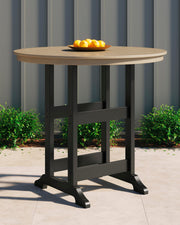 Fairen Trail outdoor pub table by Ashley Furniture with a wooden top and metal frame, ideal for patio or garden seating.