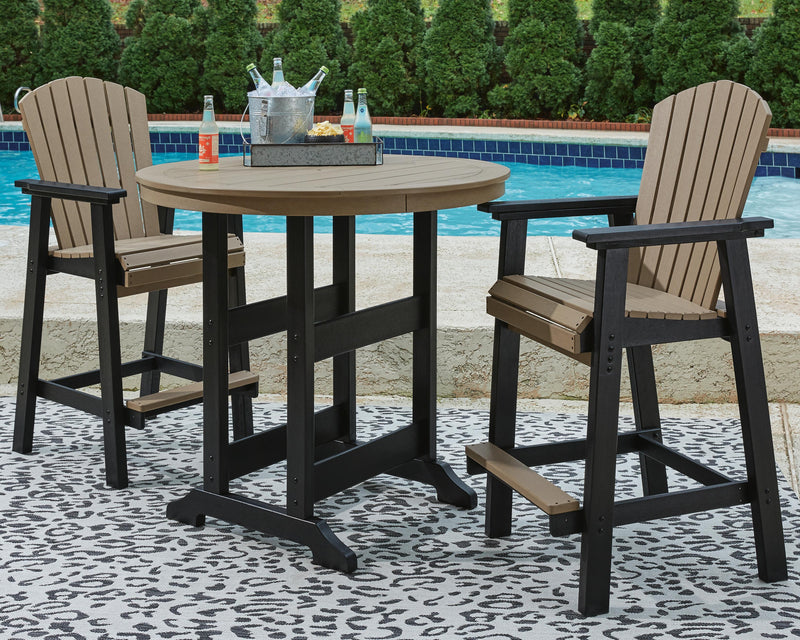 Fairen Trail outdoor dining set by Ashley Furniture with a wooden table and matching chairs, set on a patio.