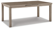Outdoor patio dining table by Ashley Furniture with a sturdy wooden top and metal legs, perfect for beach front outdoor dining areas.
