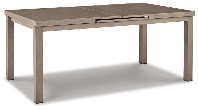 Outdoor dining set by Ashley Furniture with a spacious table and chairs, perfect for beach front outdoor gatherings.