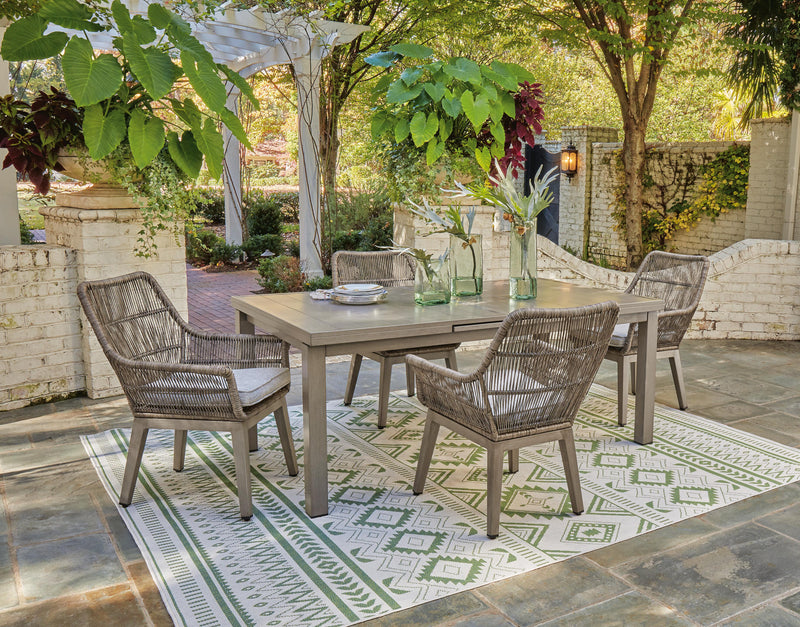Beach front outdoor dining set by Ashley Furniture featuring a table and chairs for outdoor patio gatherings.