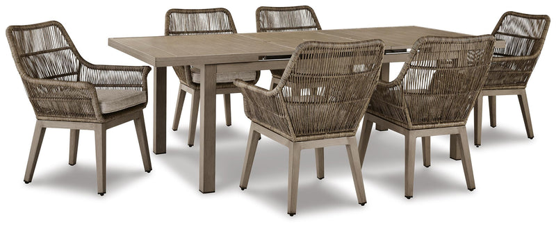 Outdoor dining set by Ashley Furniture with a table and chairs, set on a beach front patio with a scenic ocean view.