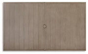 Outdoor dining table from Ashley Furniture with a natural wood finish, designed for beach front outdoor dining spaces.