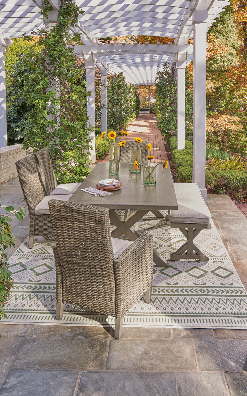 Ashley Furniture Beachcroft outdoor dining set with a table and chairs, ideal for outdoor meals and gatherings.