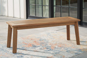 Outdoor dining bench by Ashley Furniture with wooden slats and sturdy metal legs, designed for patio or garden seating.