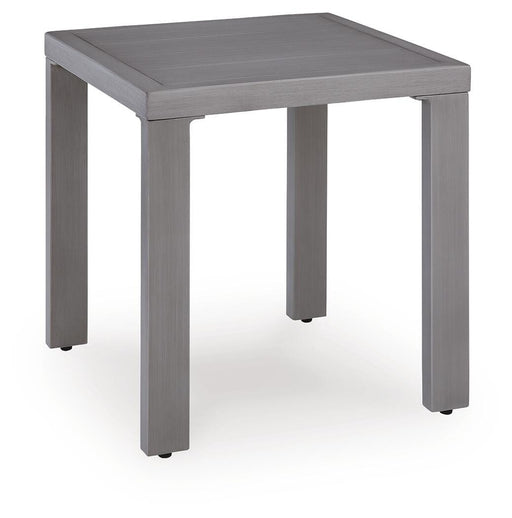 Ashley Furniture Half Moon Beach outdoor end table with a natural wood finish, featuring a curved design and sturdy construction.
