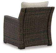 Brook Ranch outdoor lounge chair with cushion by Ashley Furniture, featuring a sturdy frame and comfortable seating for outdoor relaxation.