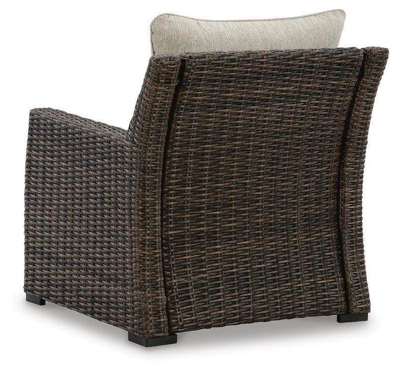 Brook Ranch outdoor lounge chair with cushion by Ashley Furniture, featuring a sturdy frame and comfortable seating for outdoor relaxation.