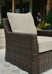 Ashley Furniture Brook Ranch outdoor lounge chair with cushion, featuring a sturdy frame and comfortable seating for outdoor spaces.