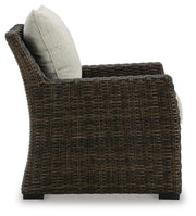Ashley Furniture Brook Ranch outdoor lounge chair with a cushion, featuring a sturdy frame and comfortable seating for outdoor relaxation.