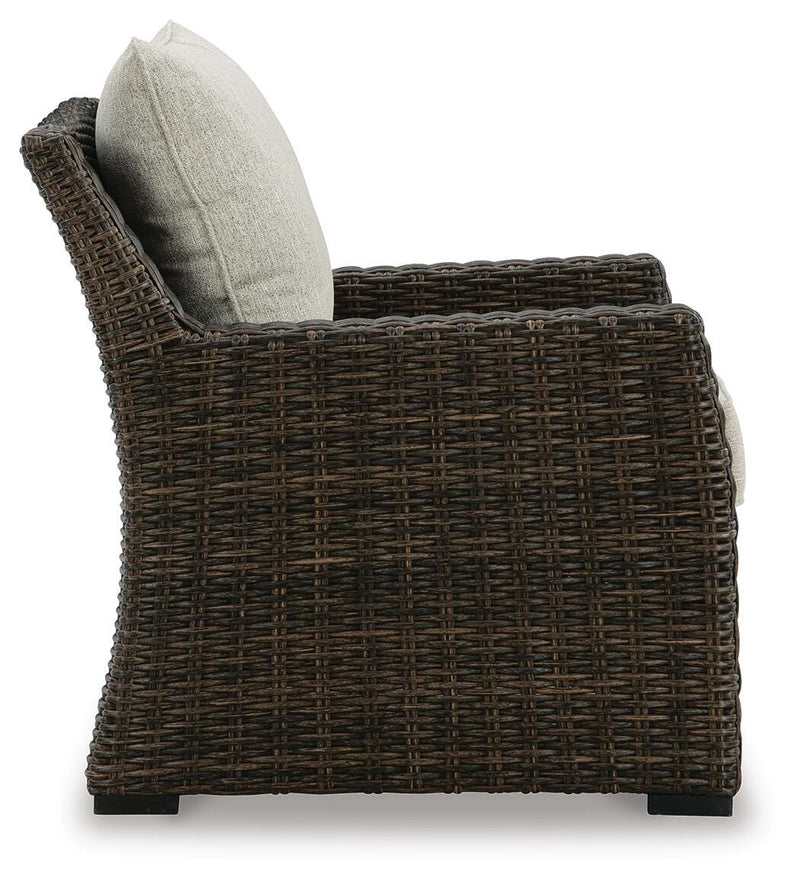 Ashley Furniture Brook Ranch outdoor lounge chair with a cushion, featuring a sturdy frame and comfortable seating for outdoor relaxation.
