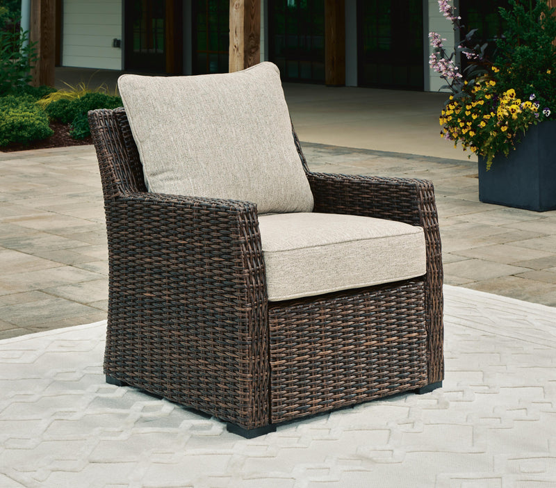 Ashley Furniture Brook Ranch outdoor lounge chair with cushion, featuring a stylish weather-resistant design for outdoor relaxation.