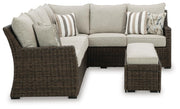 Ashley Furniture Brook Ranch outdoor sectional with three pieces and cushions, featuring sturdy wooden frames and comfortable seating.