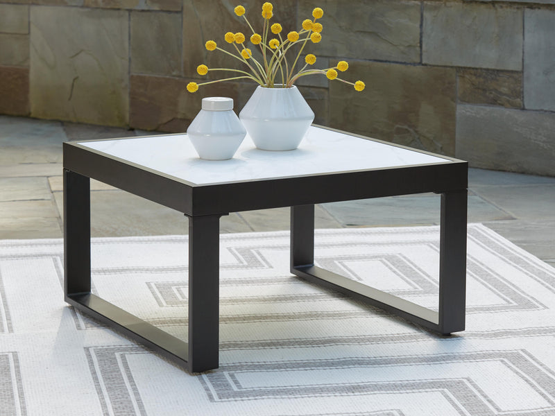 Ashley Furniture Beachloft outdoor seating set with cushioned chairs and a matching table, ideal for patio relaxation.