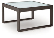 Ashley Furniture Beachloft outdoor seating set with a sofa, armchair, and coffee table in a stylish patio setting.