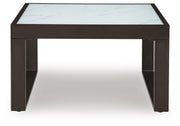 Outdoor Ashley Furniture Beachloft outdoor cocktail table with slatted wood top and sturdy metal frame, suited for patio or garden use.