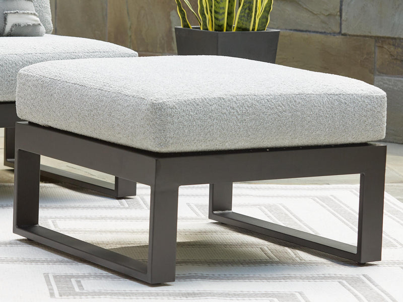 Ashley Furniture Beachloft outdoor ottoman with cushion, featuring a woven design and sturdy frame for outdoor relaxation.