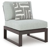 Outdoor sectional from Ashley Furniture's Beachloft collection, featuring cushioned seats and weather-resistant design in an angled view.