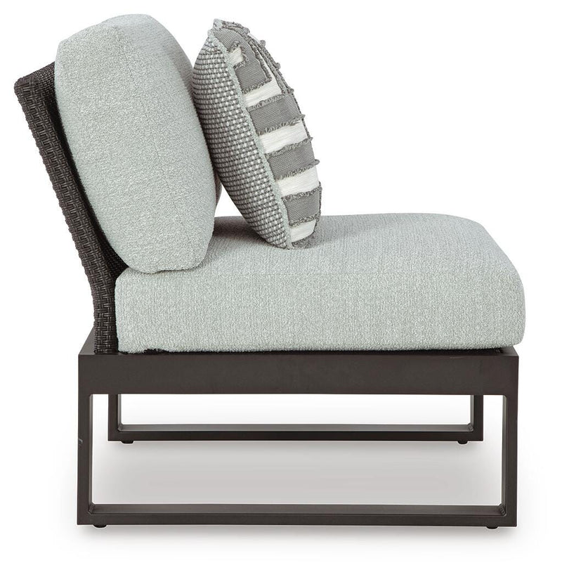 Ashley Furniture Beachloft outdoor sectional with beige cushions and woven rattan frame, designed for patio relaxation.