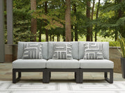 Ashley Furniture Beachloft outdoor sectional with plush cushions and wicker frame, designed for comfortable outdoor lounging.