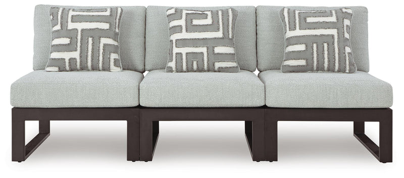 Ashley Furniture Beachloft outdoor sectional with beige cushions and woven rattan frame, perfect for patio lounging.