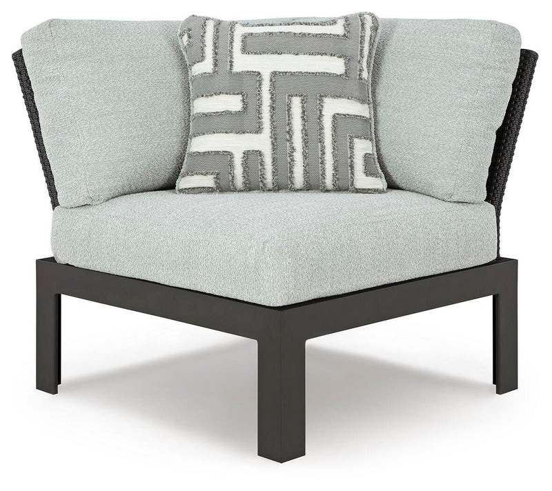 Ashley Furniture Beachloft outdoor sectional with plush cushions and wicker frame, designed for stylish outdoor lounging.