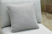 Outdoor sectional with plush pillows from Ashley Furniture's Beachloft collection, featuring a cozy seating arrangement and stylish cushions.