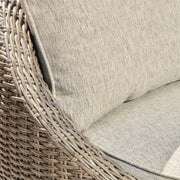 Two Ashley Furniture Danson swivel outdoor lounge chairs with cushions, featuring metal frames and comfortable seating.