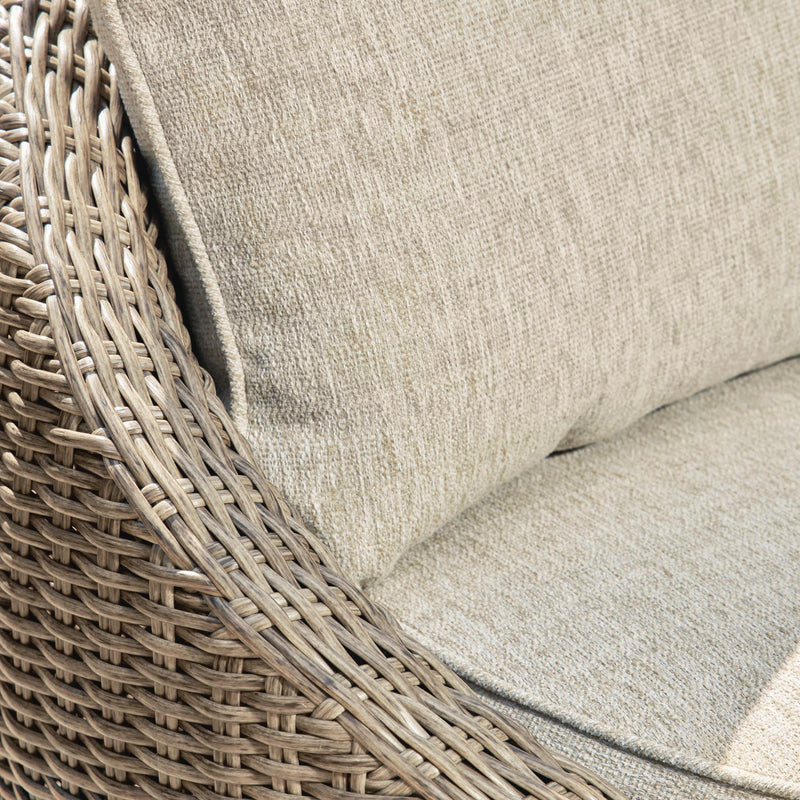 Two Ashley Furniture Danson swivel outdoor lounge chairs with cushions, featuring metal frames and comfortable seating.