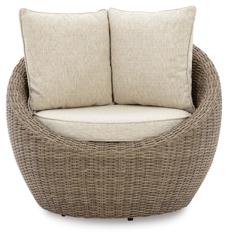 Two Ashley Furniture Danson swivel outdoor lounge chairs with cushions, shown from a head-on angle.